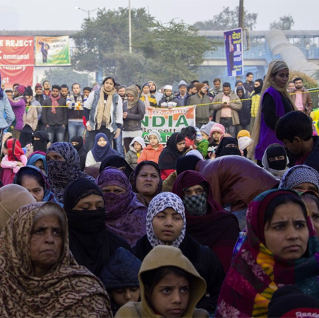 This image shows a large demonstration against the Citizenship Amendment Act (CAA) in New Delhi, India.